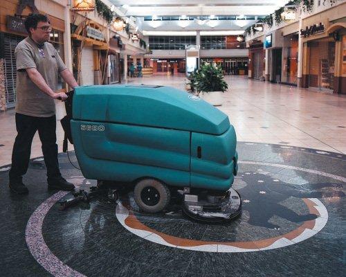 A Man cleaning the floor